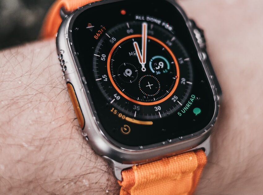 Apple Watch Ultra worn on a wrist showing its rugged dive-style bezel, illustrating the apple watch ultra 2 vs 3 comparison