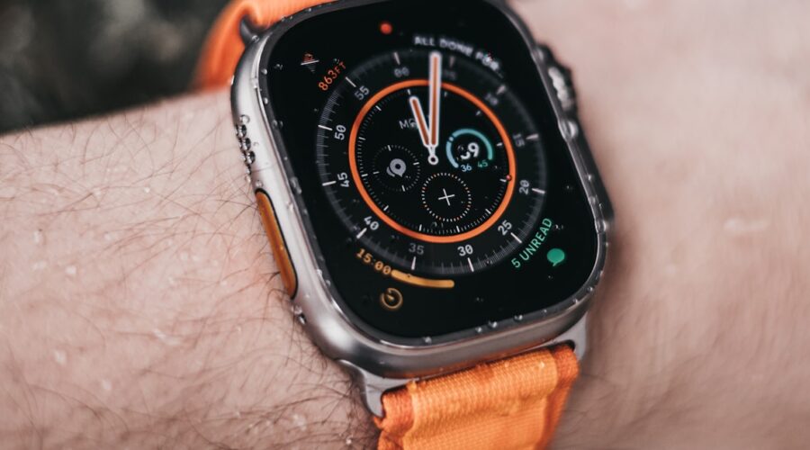 Apple Watch Ultra worn on a wrist showing its rugged dive-style bezel, illustrating the apple watch ultra 2 vs 3 comparison