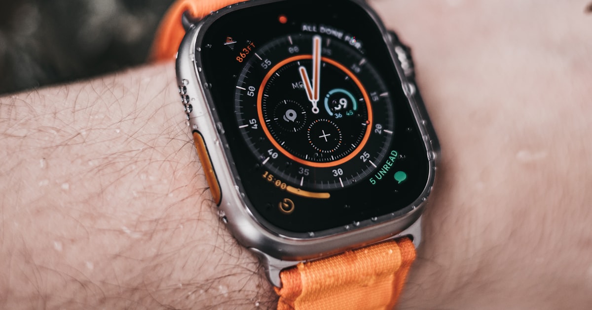 Apple Watch Ultra worn on a wrist showing its rugged dive-style bezel, illustrating the apple watch ultra 2 vs 3 comparison