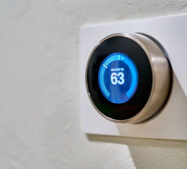Smart thermostat on a wall showing a set temperature, the upgrade renters want without rewiring