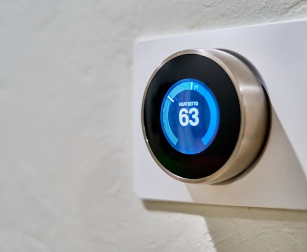 Smart thermostat on a wall showing a set temperature, the upgrade renters want without rewiring