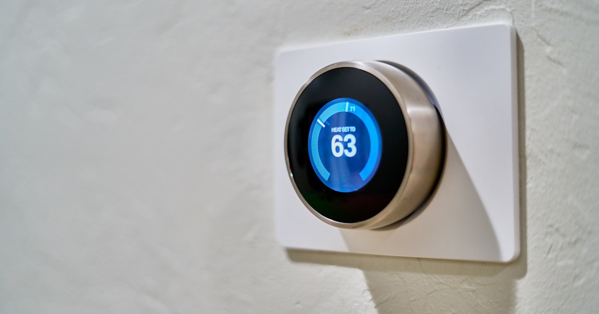 Smart thermostat on a wall showing a set temperature, the upgrade renters want without rewiring