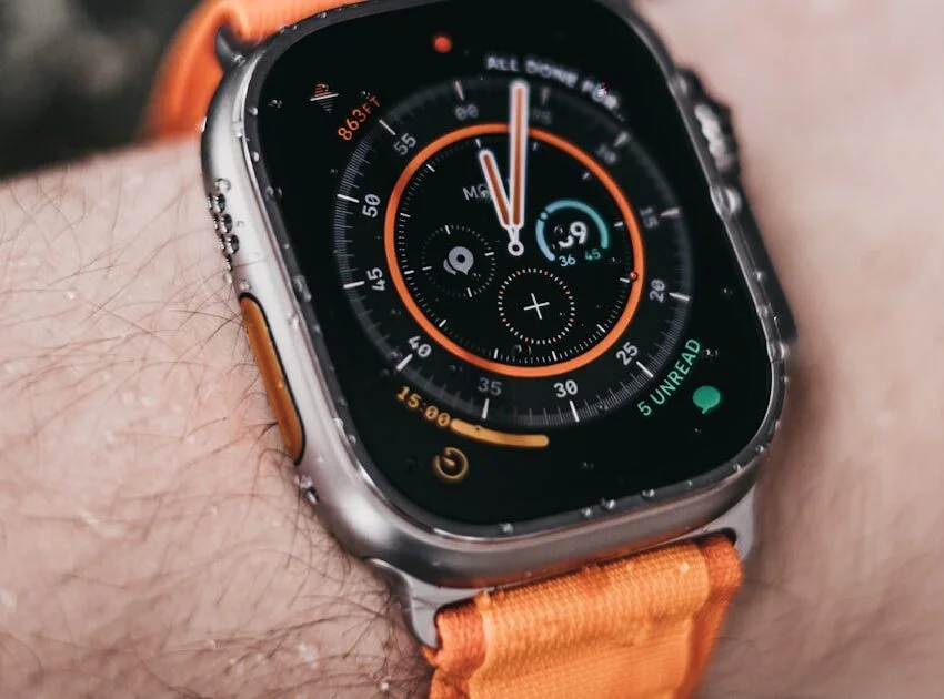 Apple Watch Ultra worn on a wrist showing its rugged dive-style bezel, illustrating the apple watch ultra 2 vs 3 comparison