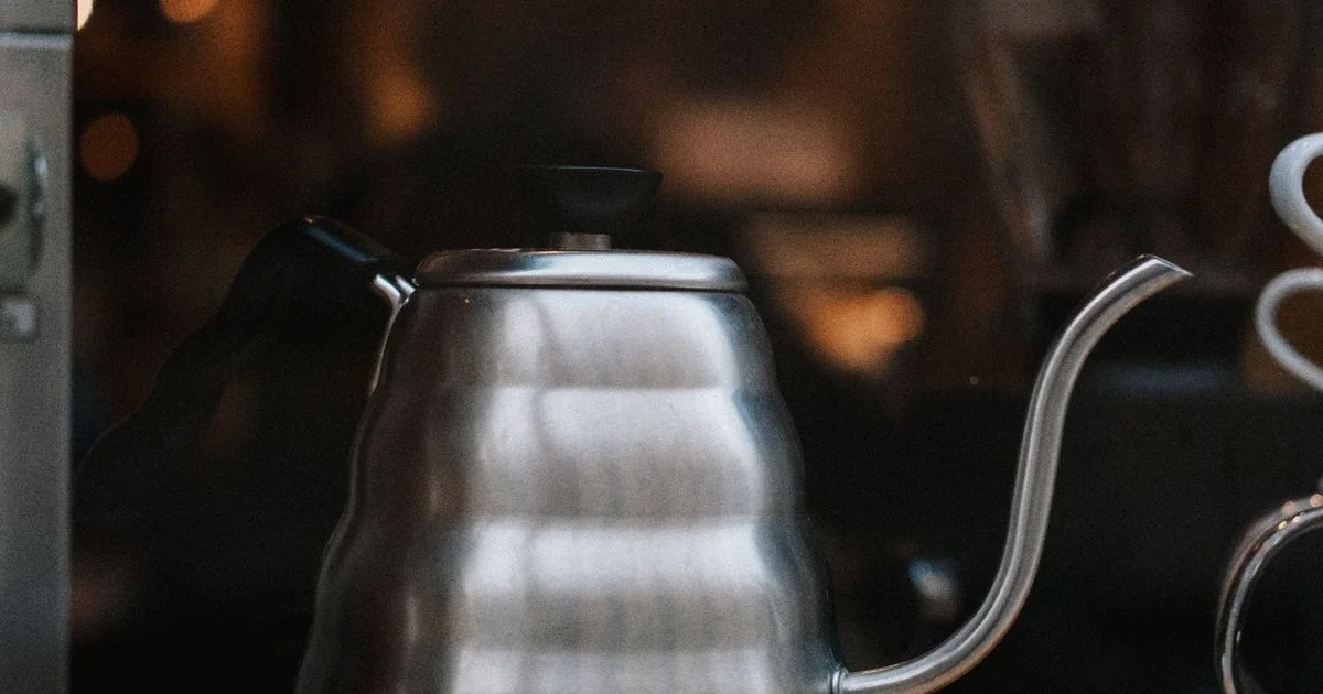 A stainless steel gooseneck kettle on a counter, the product class in the Fellow Stagg kettle versus Cosori kettle comparison
