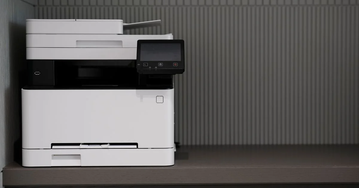 A desktop multifunction printer on a shelf, the machine class behind hp versus canon printers spec comparisons