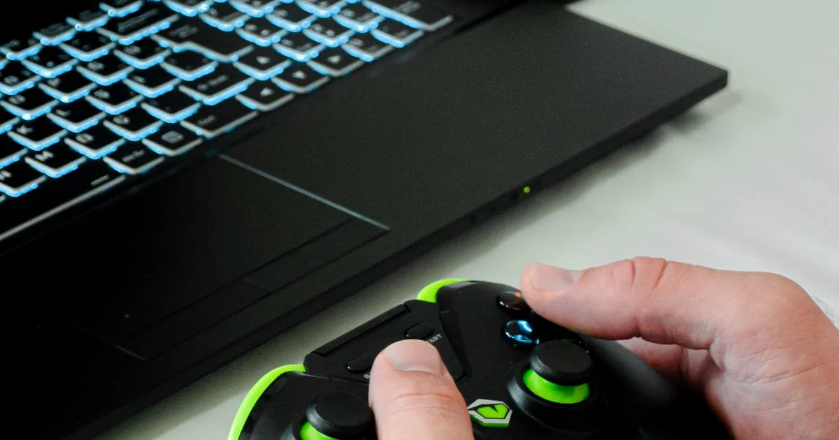 A backlit gaming laptop keyboard in use, the product class in the Lenovo Gaming vs Lenovo Legion comparison