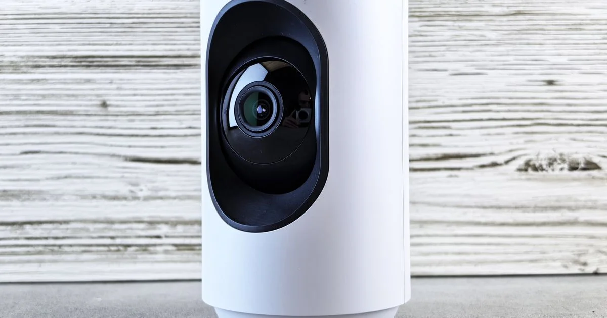 A white home security camera and its wide-angle lens, the hardware behind the difference between Nest Cam and Ring Camera specs