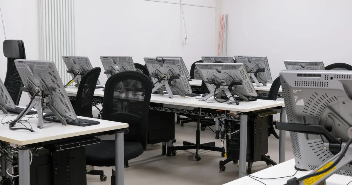 Rows of identical test machines in a lab, the setup behind every Norton antivirus versus McAfee antivirus score