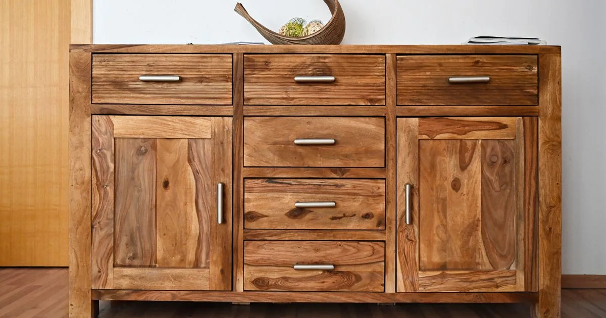 A solid wood sideboard with continuous grain running across its drawer fronts, the timber side of the solid wood furniture vs particle board comparison